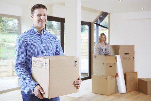 Team coordinating furniture pick-up in a modern home